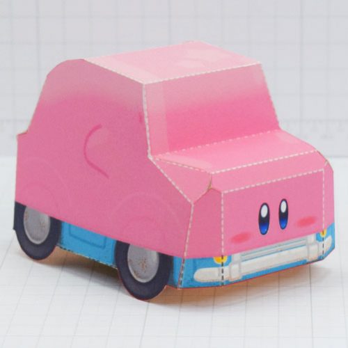 A photo of a paper toy of Kirby in 'mouthful mode' from the game Kirby and the Forgotten Land. This mode has been dubbed 'Karby' by online fans.