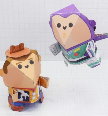 Paper toys of Woody and Buzz Lightyear from Toy Story. Woody is stood on the floor looking towards Buzz, who is flying nearby.