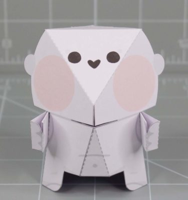 A photo of a Fold Up Friends papercraft. The design has a cute shape with a large head and small face.