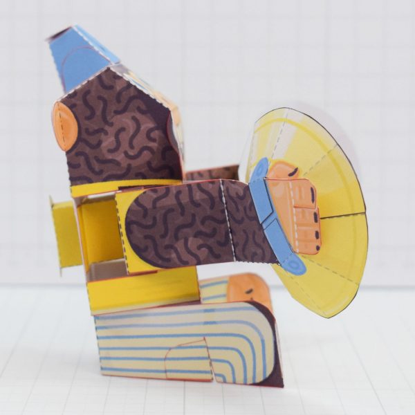 A photo of the Manic Monkey Paper toy automata from the side.