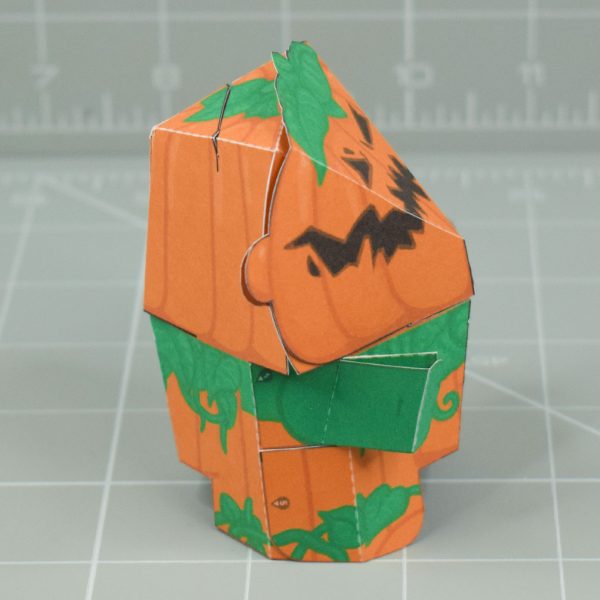 a photo of a papercraft pumpkin monster