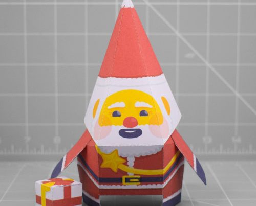 A photo of a papercraft depicting a stylised Santa Claus