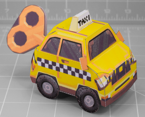 A photo of a papercraft depciting the taxi from the game Yellow Taxi Goes Vroom
